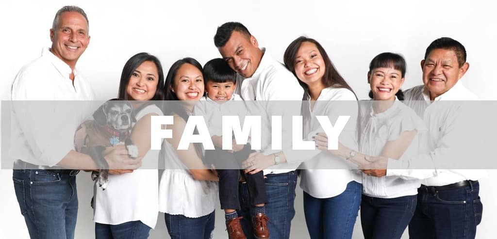 Happy family posing for a professional family photography session outdoors