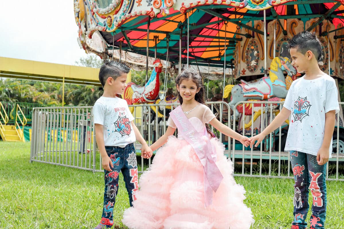 Smiling kids and family enjoying a birthday party, captured by a Miami photographer
