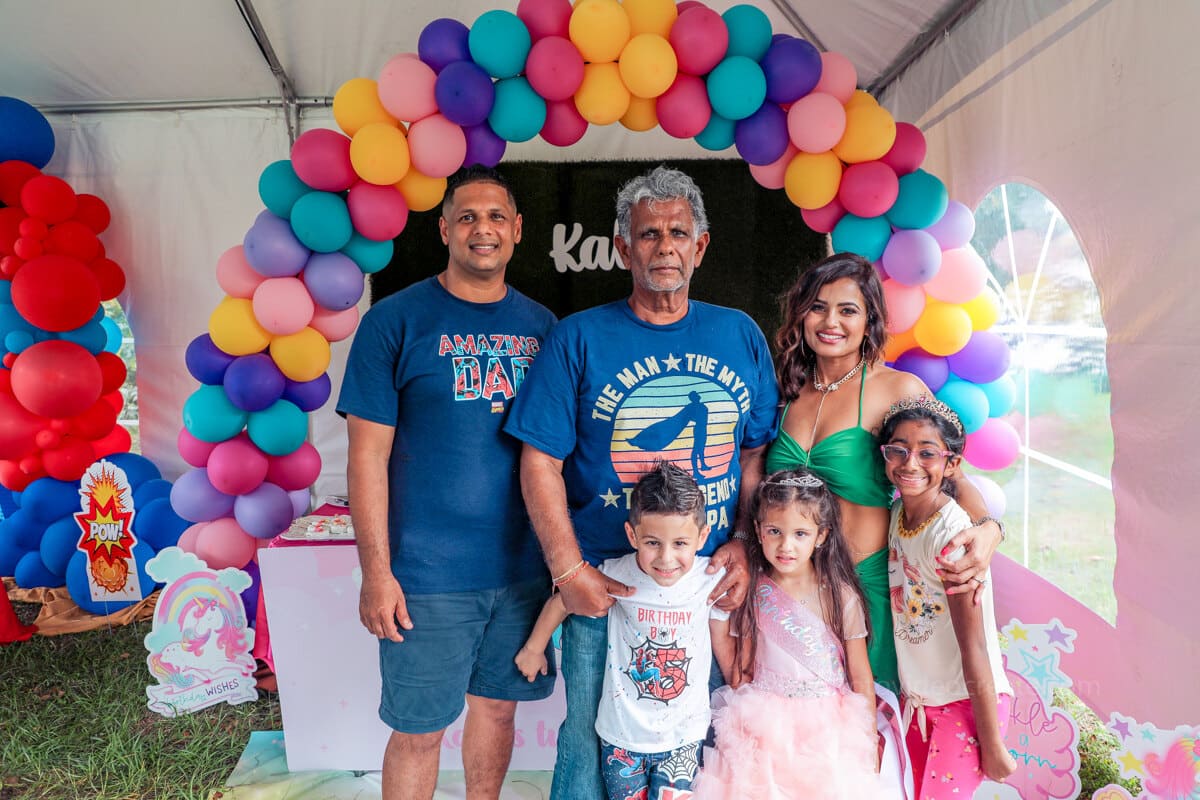 Smiling family enjoying a kid’s birthday party in Miami, professionally photographed