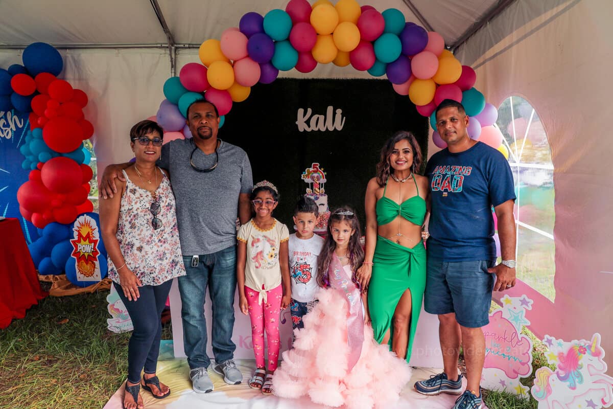 Happy family celebrating a kid’s birthday party in Miami, captured by a professional photographer