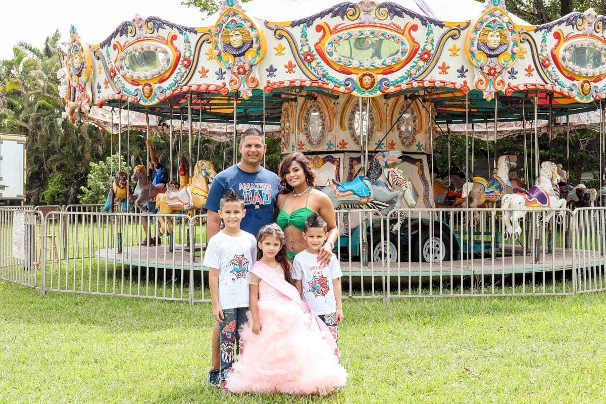 Smiling kids and family enjoying a birthday party, captured by a Miami photographer
