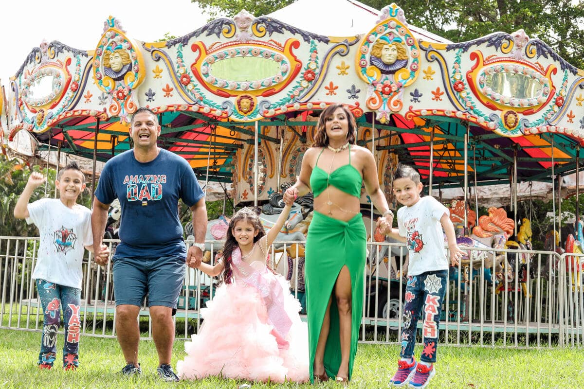 Happy family and kids enjoying a birthday party, photographed in Miami