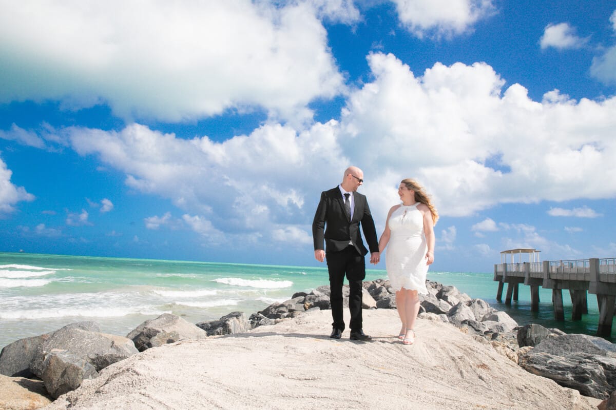 Elegant couple posing at Miami Beach City Hall during their wedding, photographed by a Miami photographer