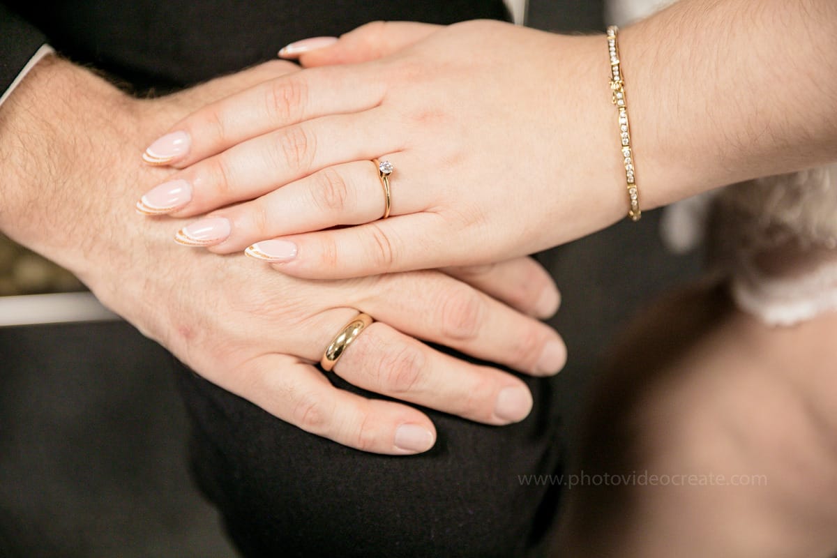 Elegant couple posing at Miami Beach City Hall on their wedding day, photographed by a Miami wedding photographer