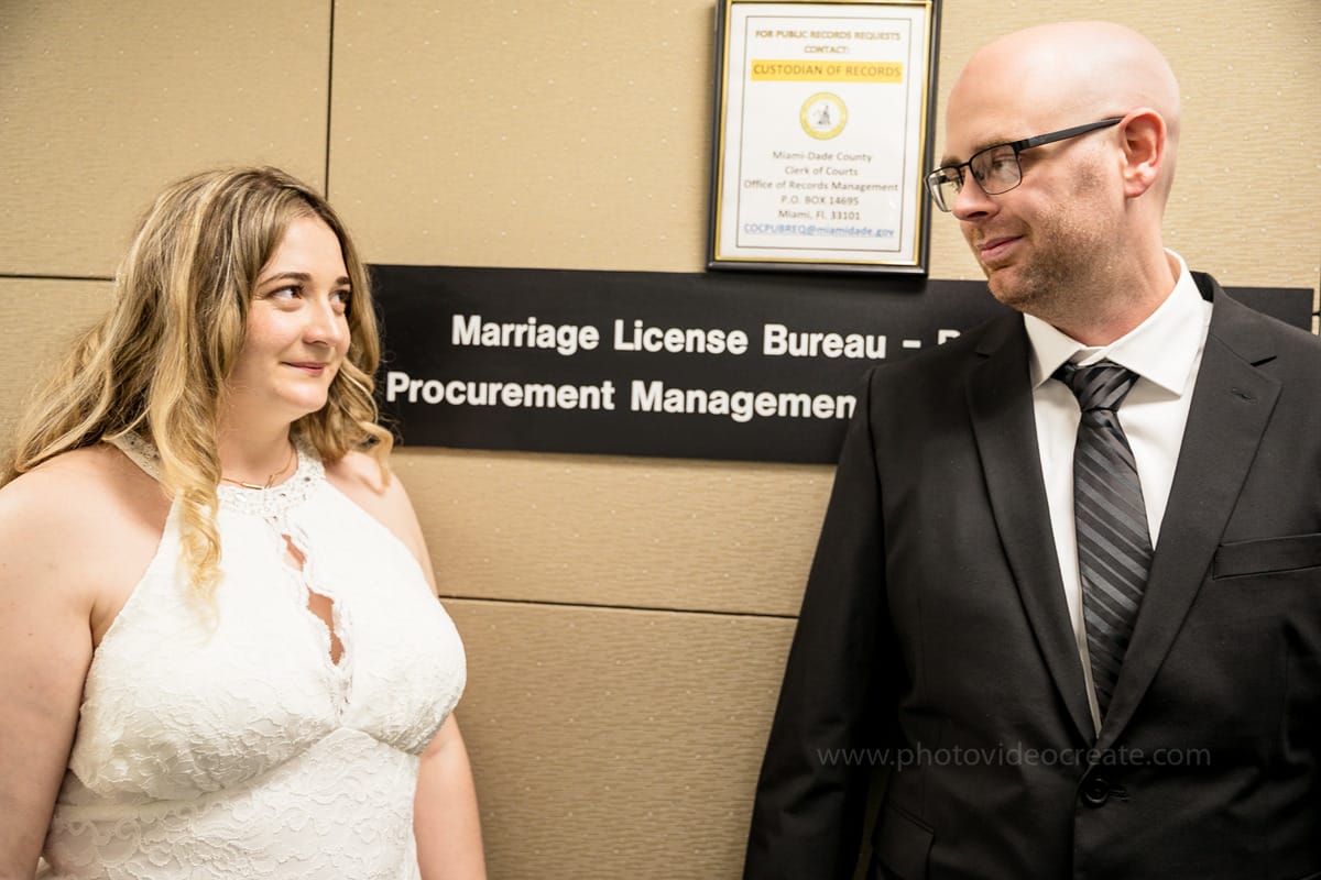 Stylish bride and groom outside Miami Beach City Hall during their courthouse wedding, captured by a Miami photographer