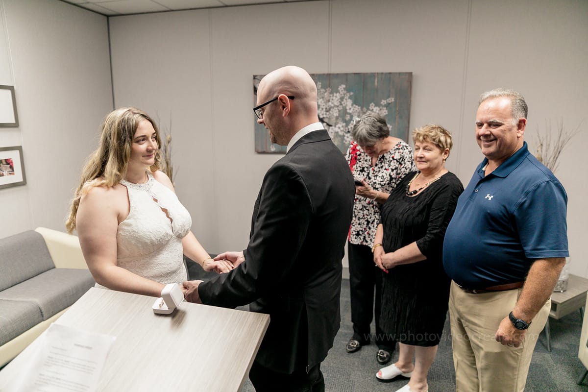 Bride and groom sharing a happy moment outside Miami Beach City Hall during their courthouse wedding