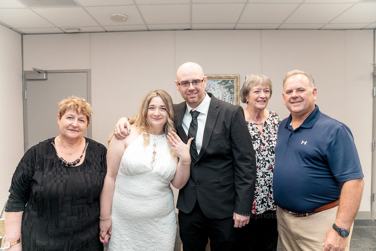 Couple embracing outside Miami Beach City Hall during their intimate courthouse wedding, photographed by a Miami photographer