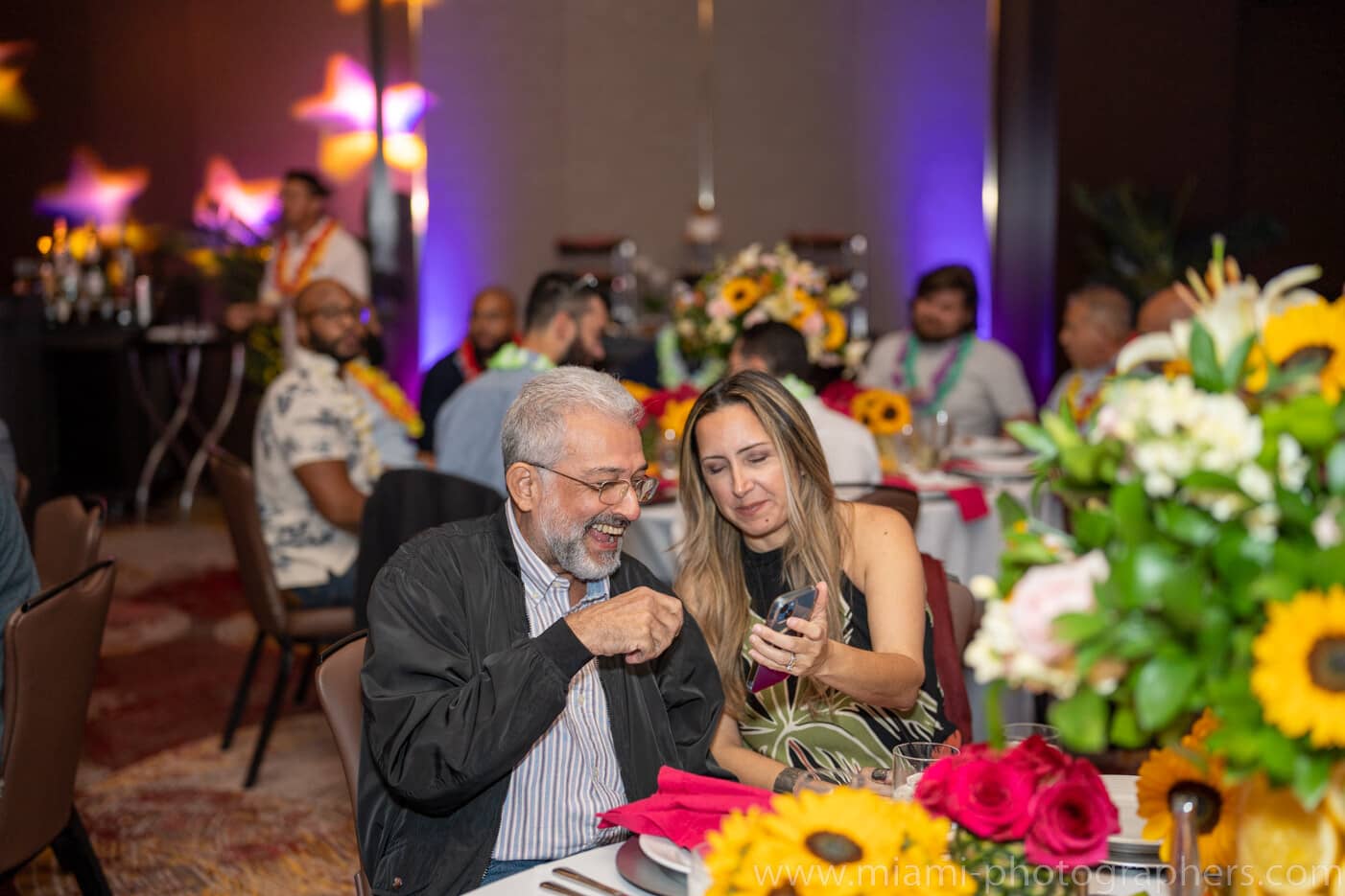 Jewish bride and groom exchanging vows under the chuppah during a wedding ceremony in Miami.```