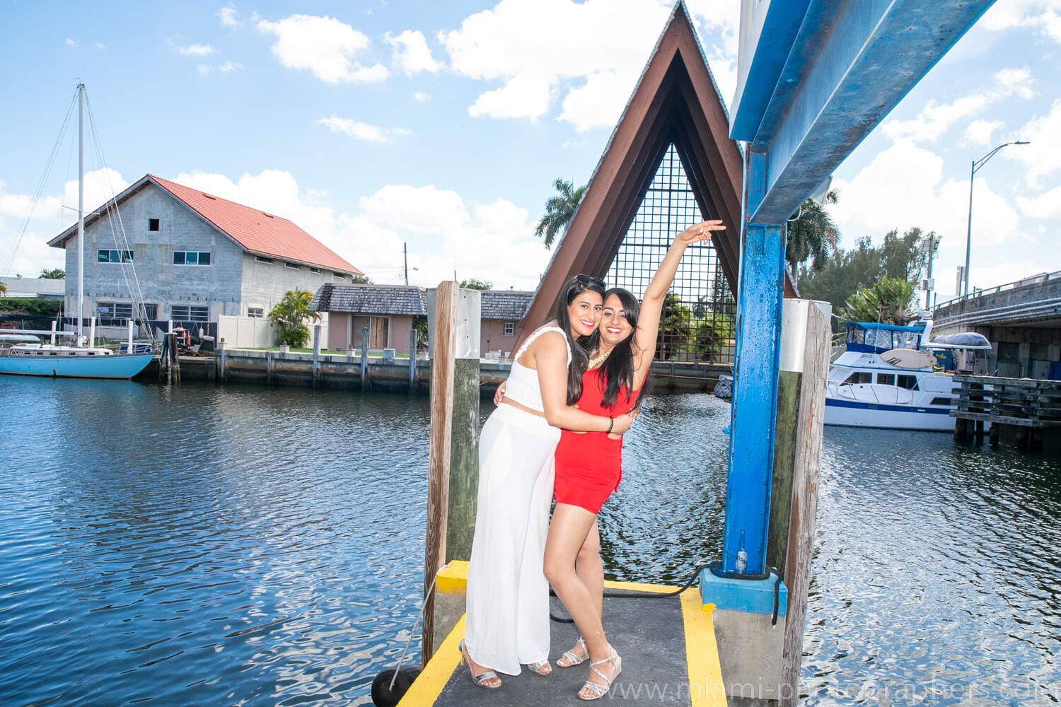 Joyful bride-to-be sharing a laugh with friends during a bachelorette party on a Miami yacht, captured by a professional photographer