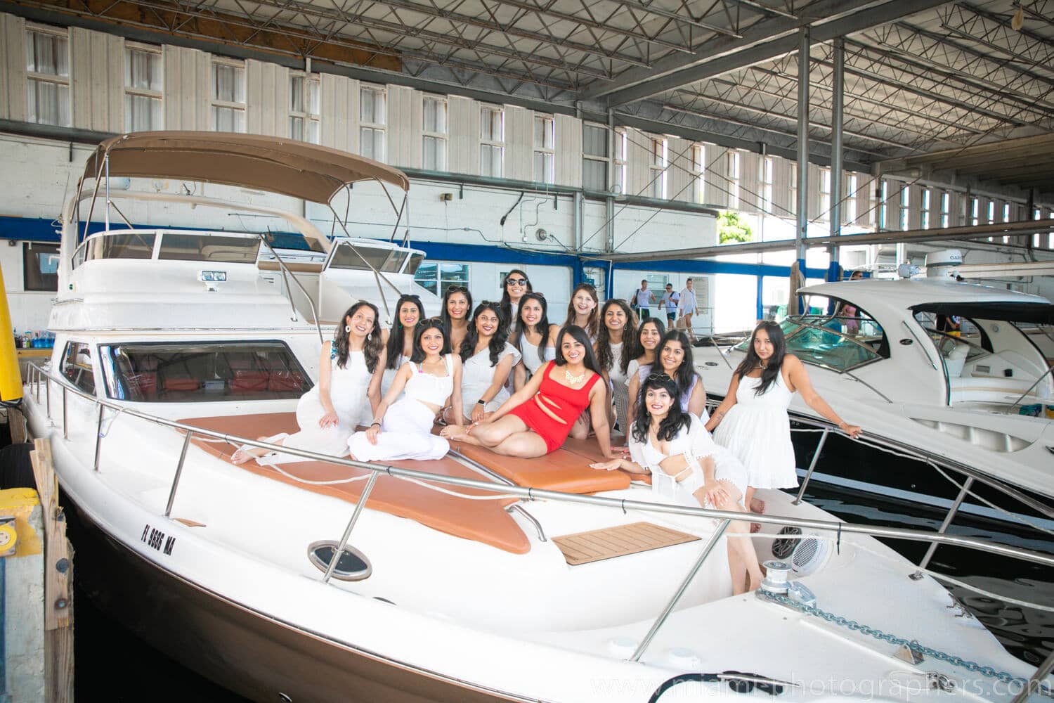 Bride-to-be and friends having fun and celebrating on a yacht during a Miami bachelorette party, captured by a professional photographer
