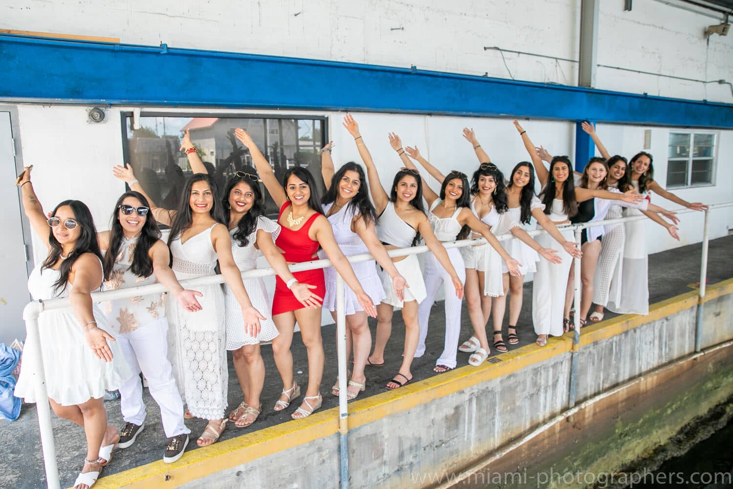 Bride-to-be and her friends enjoying a toast while celebrating on a Miami yacht during a bachelorette party, captured by a professional photographer