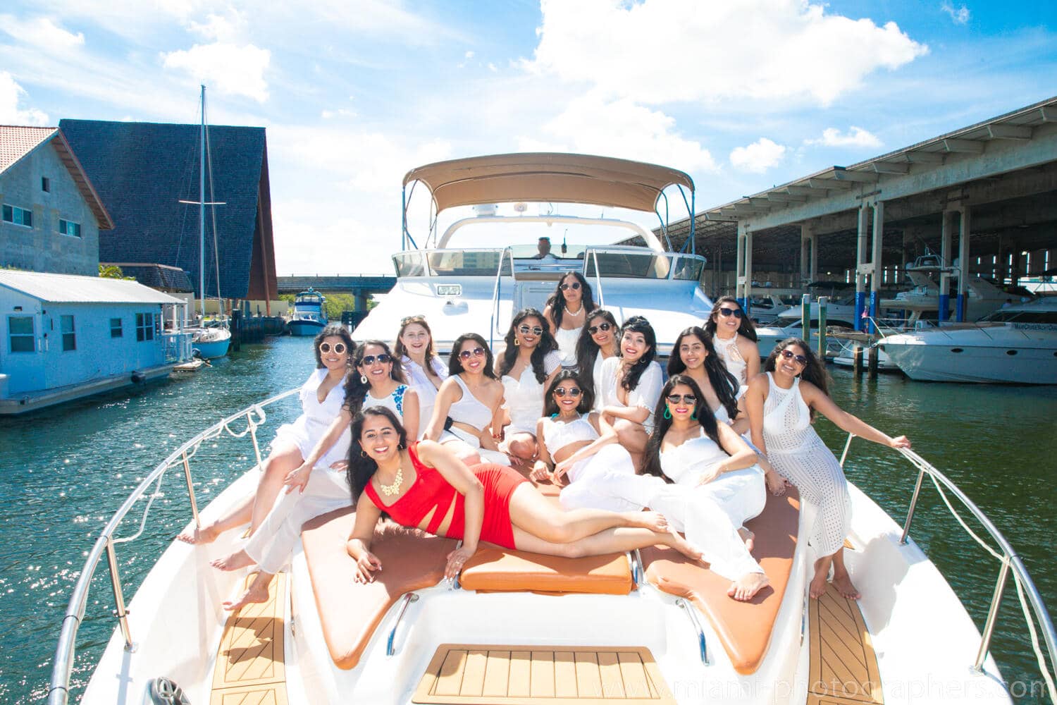Bride-to-be and her friends enjoying a lively bachelorette party on a yacht in Miami, captured by a professional photographer