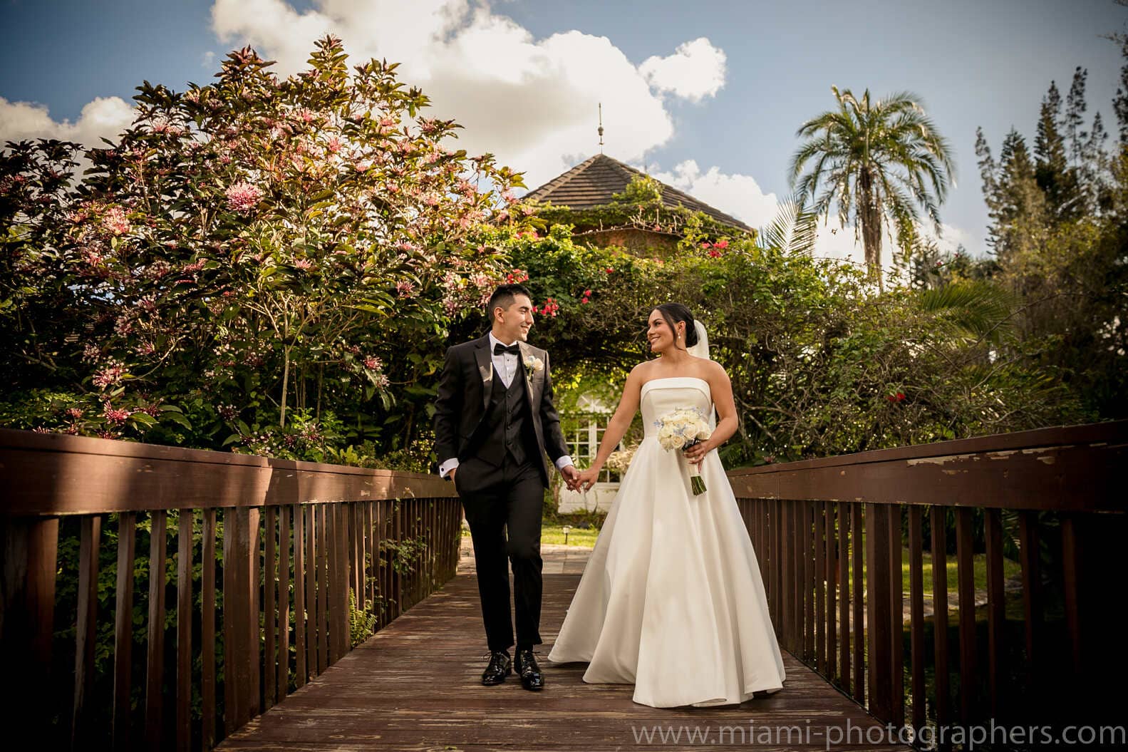 Bride and groom Roxana and Andres sharing a tender and joyful moment during their romantic wedding in Miami, captured with soft natural light.
