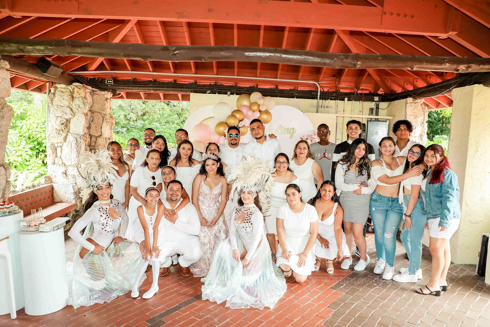 Memorable moment of a young woman celebrating her Quinceañera at Pinecrest Gardens in Miami, professionally photographed