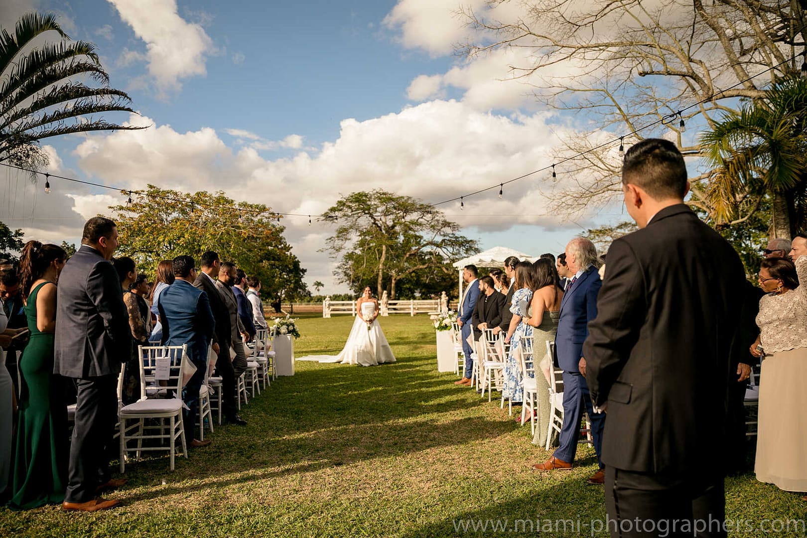 Bride and groom Roxana and Andres sharing a romantic moment during their Miami wedding, captured with soft natural light and elegant details.
