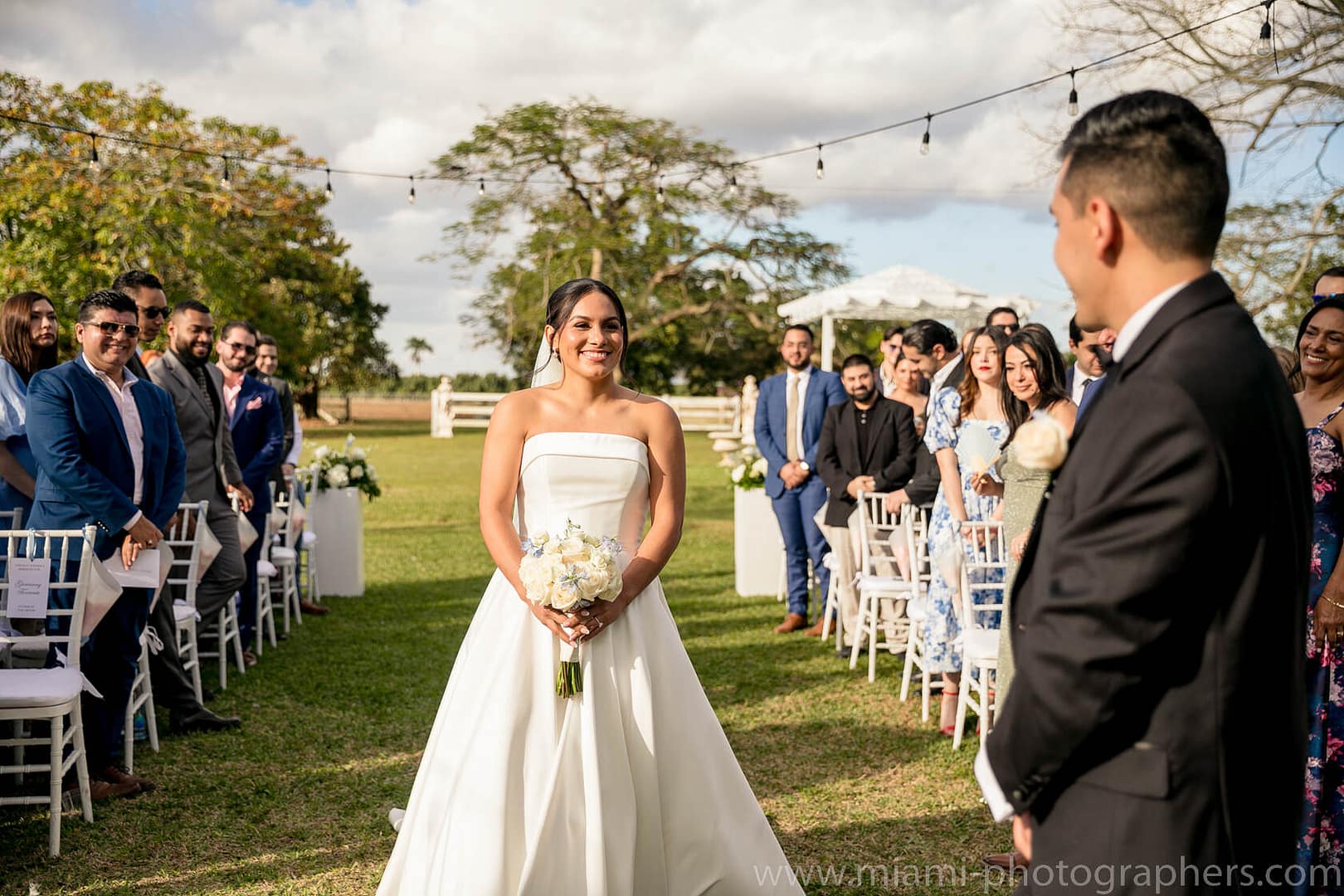 Bride and groom Roxana and Andres sharing a heartfelt moment during their intimate Miami wedding, captured with soft lighting and elegant surroundings.