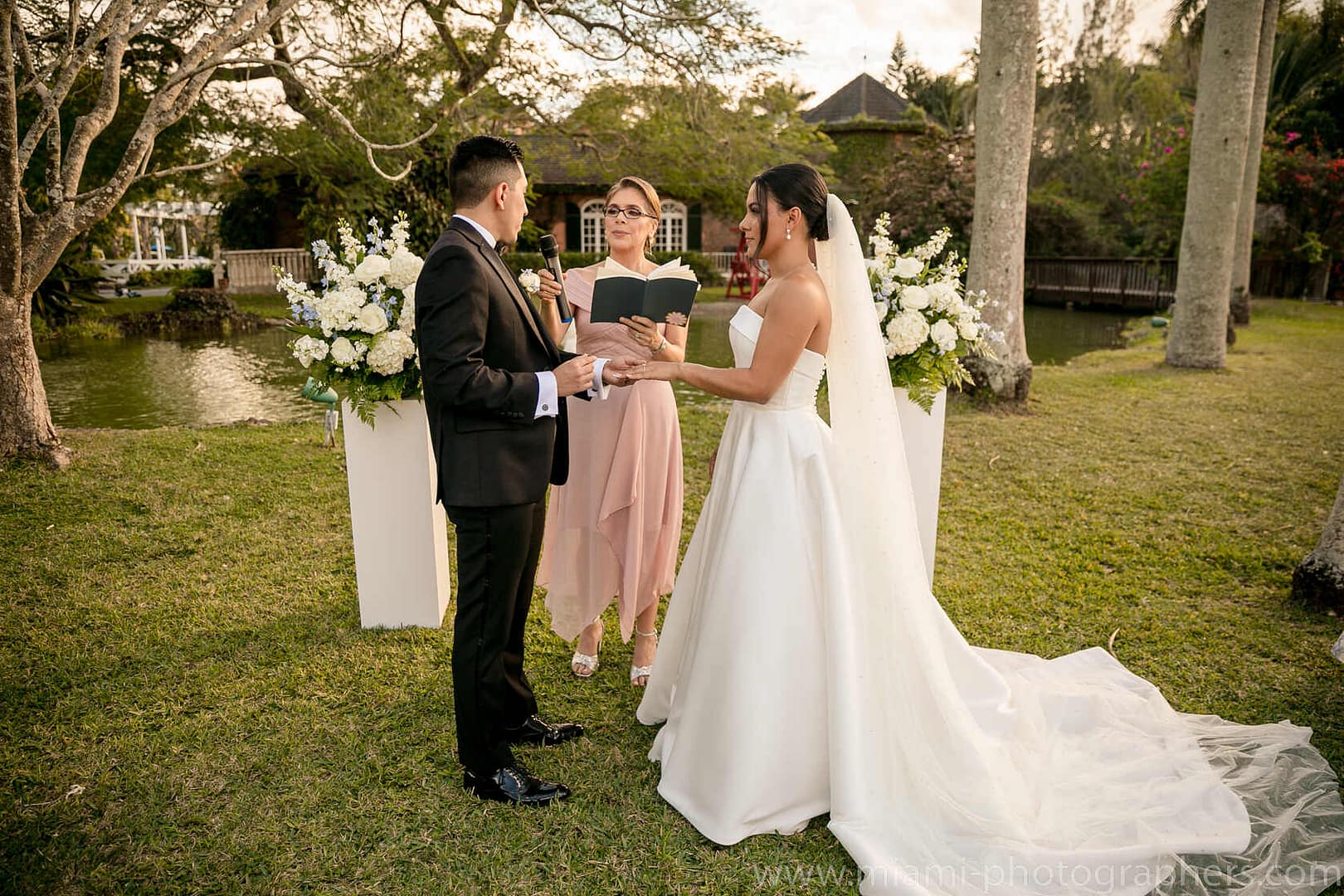 Bride and groom Roxana and Andres sharing a romantic moment during their elegant Miami wedding, captured with soft lighting and graceful details.