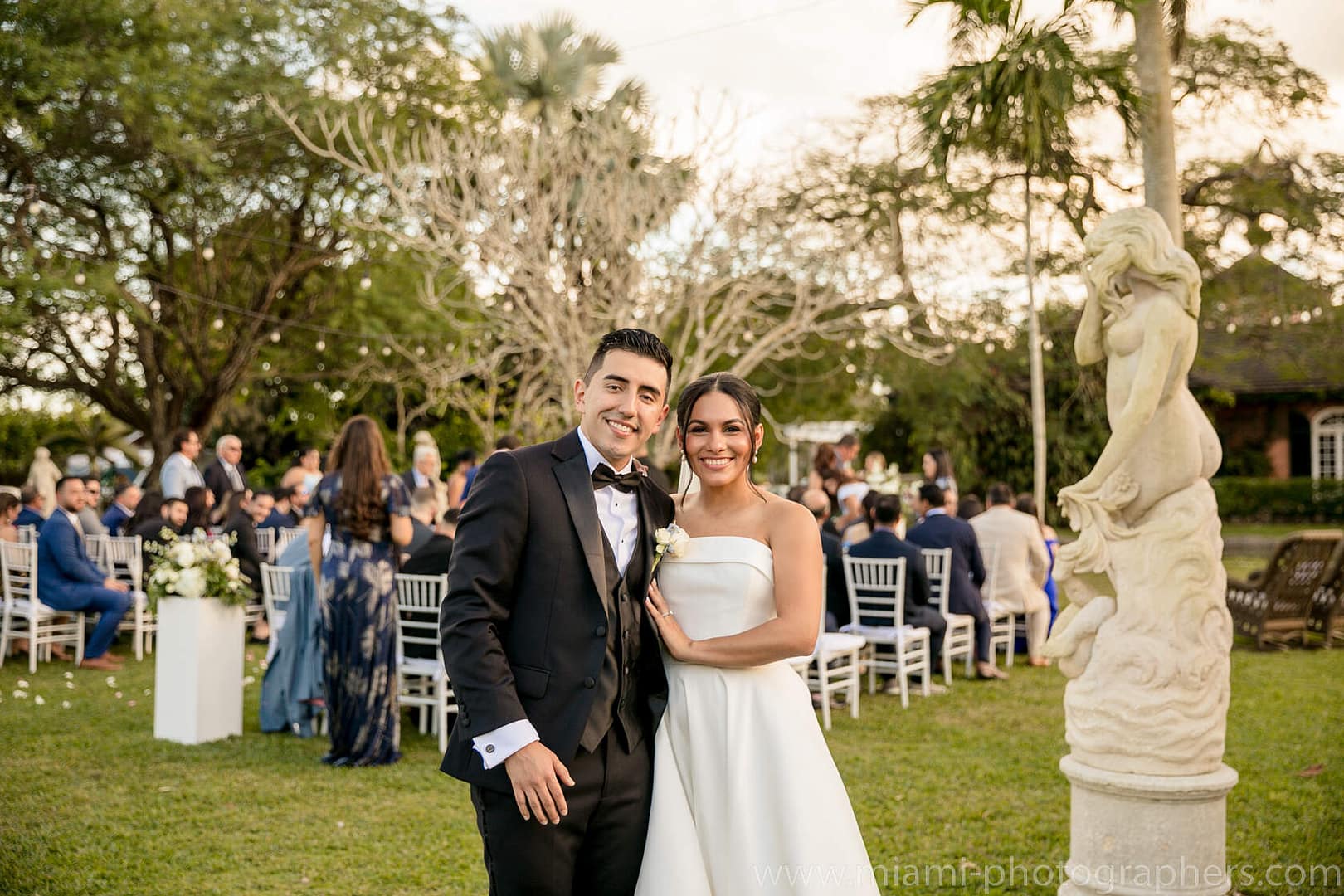 Bride and groom Roxana and Andres sharing an elegant moment during their Miami wedding, captured with soft lighting and romantic surroundings.