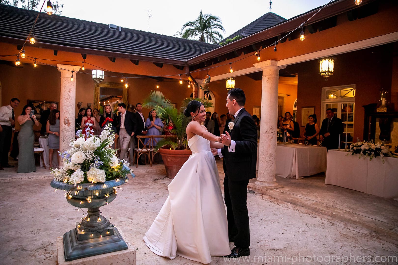 Bride and groom Roxana and Andres sharing a romantic moment during their elegant Miami wedding, bathed in soft natural light and surrounded by beautiful details.