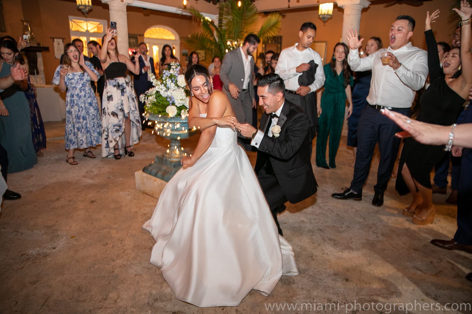 Roxana and Andres standing close during their Miami wedding, sharing a quiet and romantic moment captured with elegant detail and soft natural light.