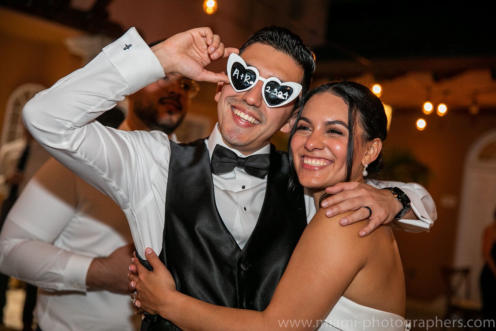 Bride and groom, Roxana and Andres, sharing a romantic moment during their elegant Miami wedding, surrounded by soft natural light and timeless details.
