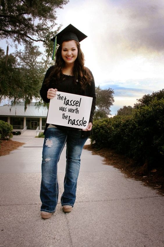 9 Creative Graduation Photoshoot Ideas 2024 For Memorable Day 19 graduation photoshoot holding sign