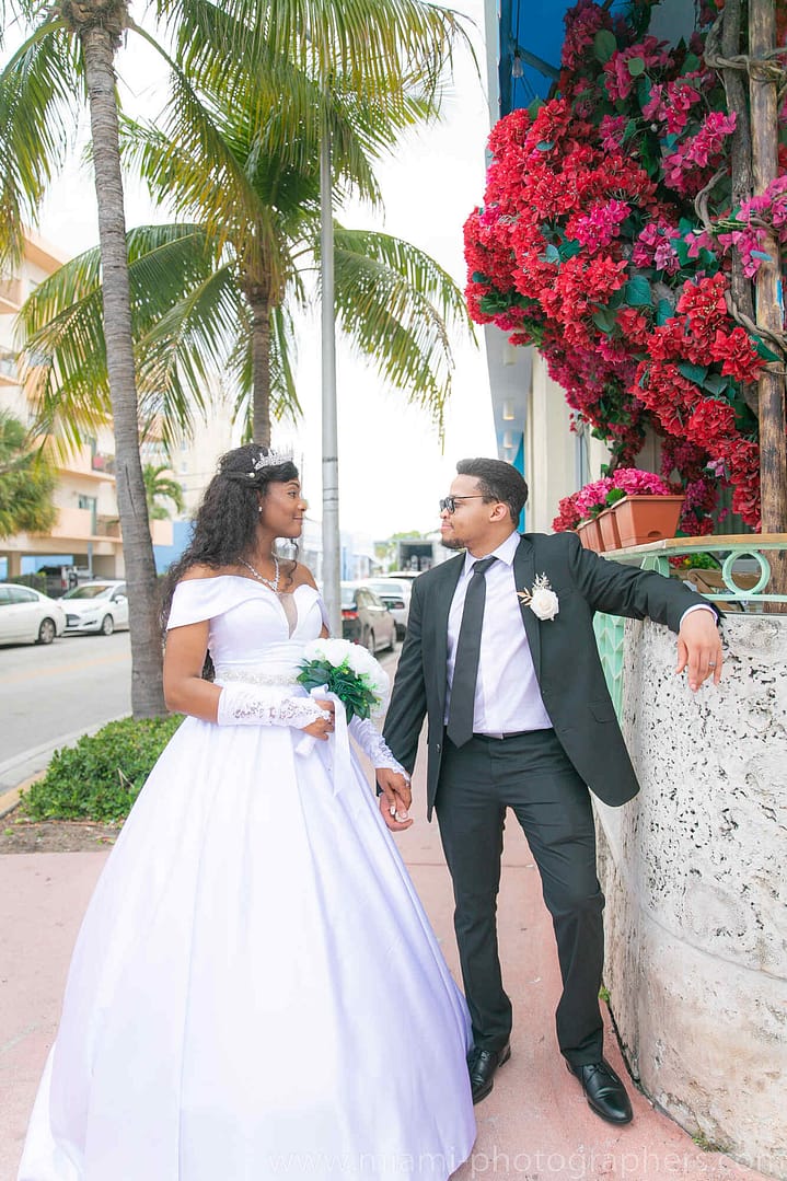 Bride and groom Roxana and Andres sharing a joyful moment during their Miami wedding, beautifully captured with natural light and elegant details.