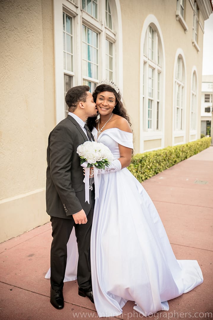 Jewish bride and groom sharing a joyful dance under the chuppah during their Miami wedding celebration.