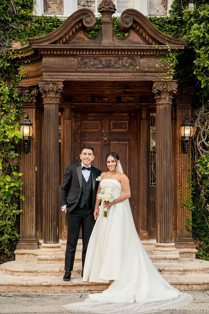 Bride and groom Roxana and Andres enjoying a joyful and elegant moment on their wedding day in Miami, surrounded by soft light and romantic ambiance.