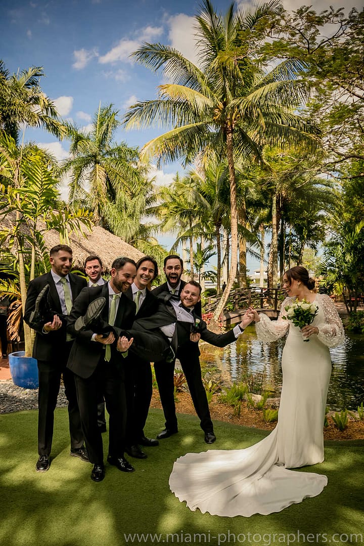 Bride and groom Roxana and Andres posing elegantly during their Miami wedding, surrounded by soft natural light and romantic ambiance.