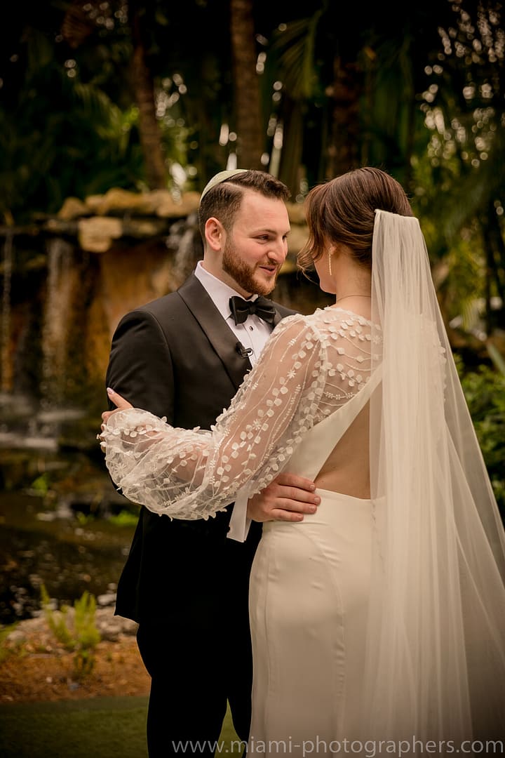 Bride and groom Roxana and Andres sharing an emotional and intimate moment during their Miami wedding, captured with romantic lighting and elegant detail.