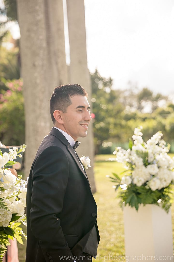 Bride and groom Roxana and Andres sharing a joyful and intimate moment during their elegant Miami wedding, captured with soft lighting and beautiful surroundings.