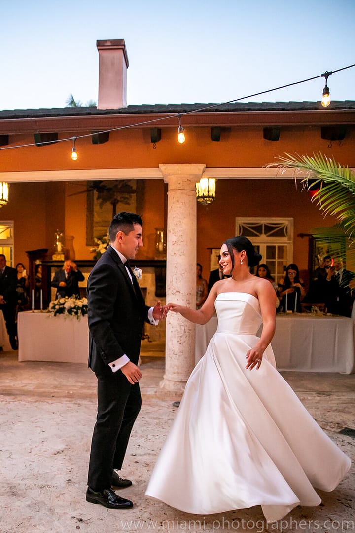 Bride and groom Roxana and Andres sharing a tender moment during their intimate Miami wedding, captured with soft lighting and elegant surroundings.
