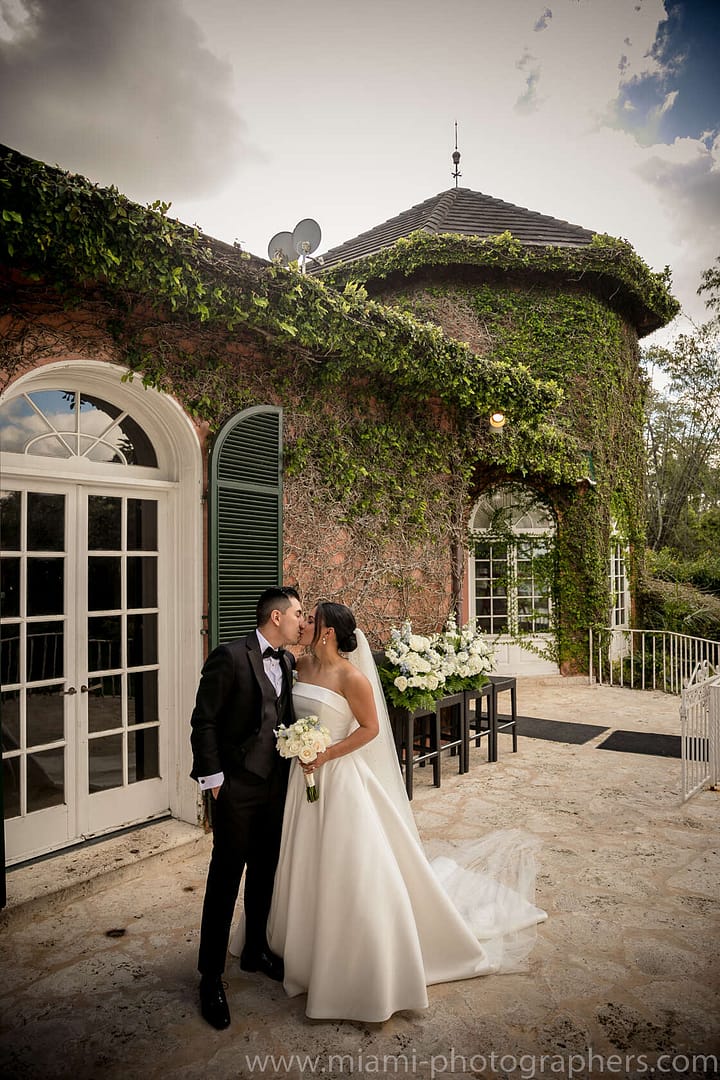 Close-up moment of Roxana and Andres during their Miami wedding, highlighting their emotional connection and elegant attire in soft, natural light.