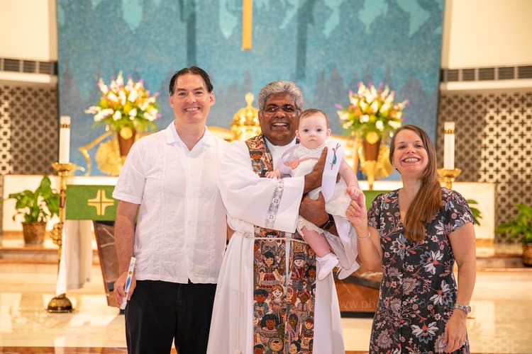 Sacred baptism moment at St. Rose of Lima Church in Miami captured by a local professional photographer