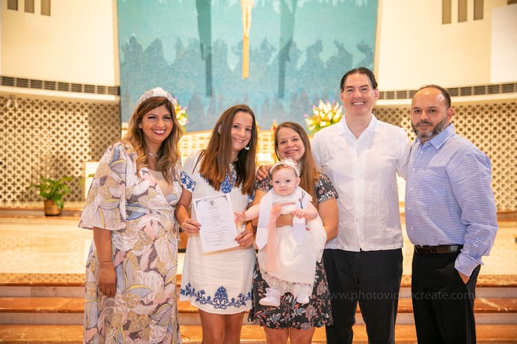 Beautiful baptism moment at St. Rose of Lima Church in Miami captured by a professional photographer