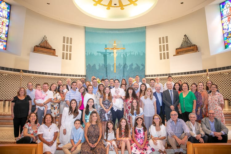 Tender baptism moment at St. Rose of Lima Church in Miami photographed by a local professional