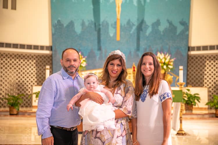 Heartfelt baptism moment captured at St. Rose of Lima Church in Miami by a local professional photographer
