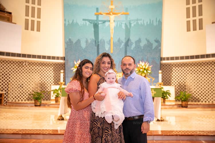 Family baptism photo inside St. Rose of Lima Church, Miami, taken by a professional photographer