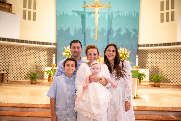 Photographer capturing special baptism moments at St. Rose of Lima Church, Miami
