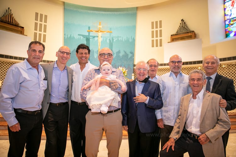 Photographer capturing memorable baptism ceremony at St. Rose of Lima Church, Miami