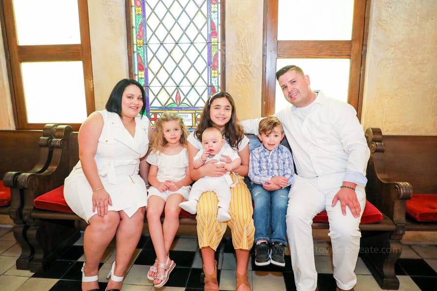 Precious moment during a baptism ceremony at Coral Gables United Church of Christ, captured by a Miami event photographer