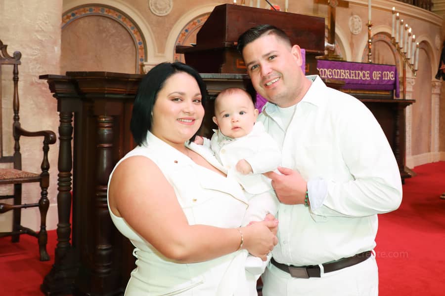 Family and friends gathered happily during baptism ceremony at Coral Gables United Church of Christ in Miami