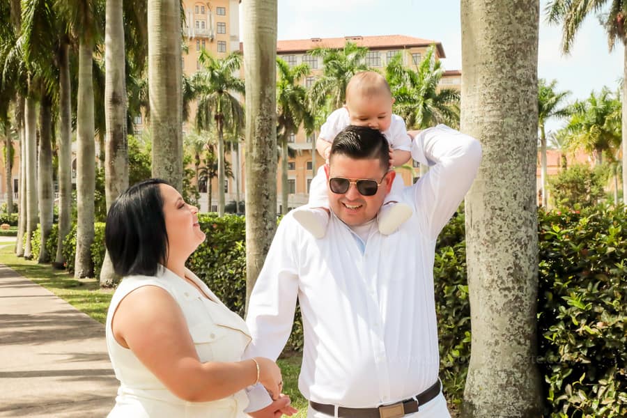 Family smiling together after baptism ceremony at Coral Gables United Church of Christ in Miami